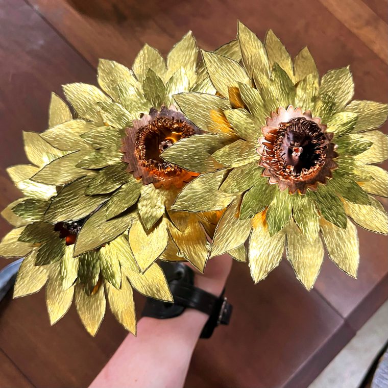 large metal sunflowers made of brass and copper